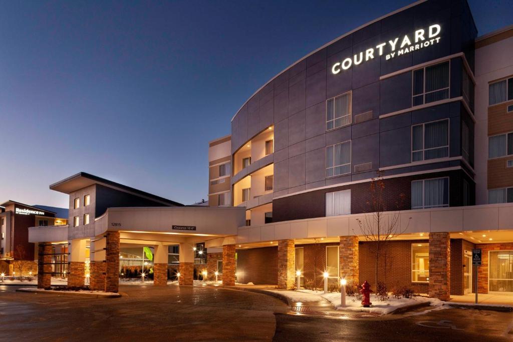 a rendering of a court yard hotel at night at Courtyard by Marriott St. Louis West County in Saint Louis