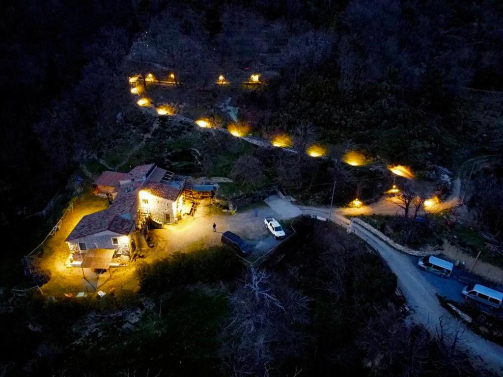 an overhead view of a house at night with lights at SKY HOUSE Experience in Orco Feglino