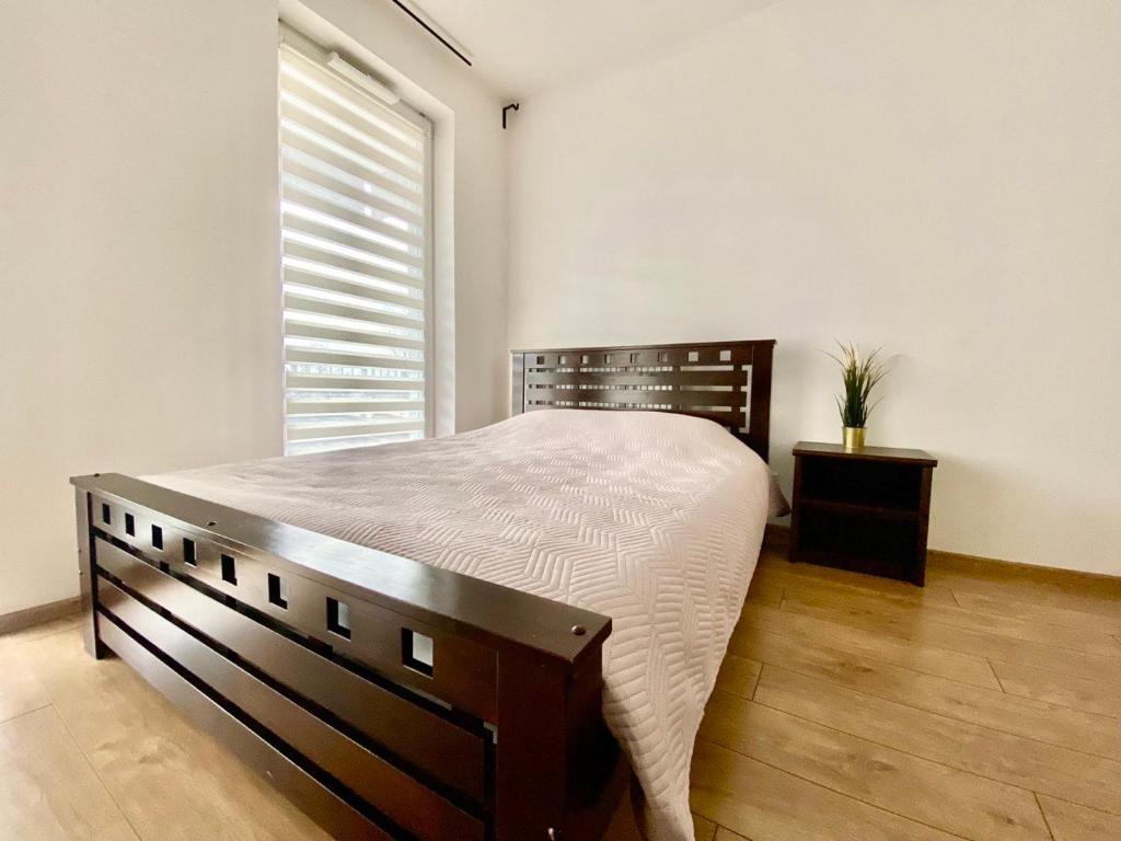 Posteľ alebo postele v izbe v ubytovaní K22 Komputerowa Warsaw Apartments