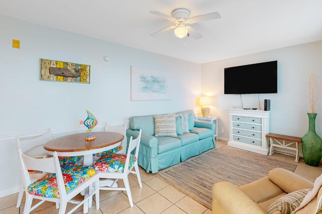 a living room with a couch and a table at Perdido Skye G3 in Perdido Key