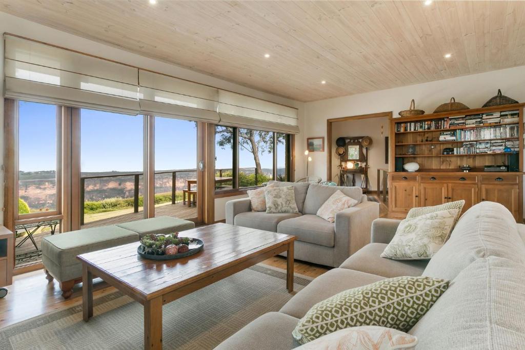 a living room with a couch and a table at Shirri Mirri in Leura