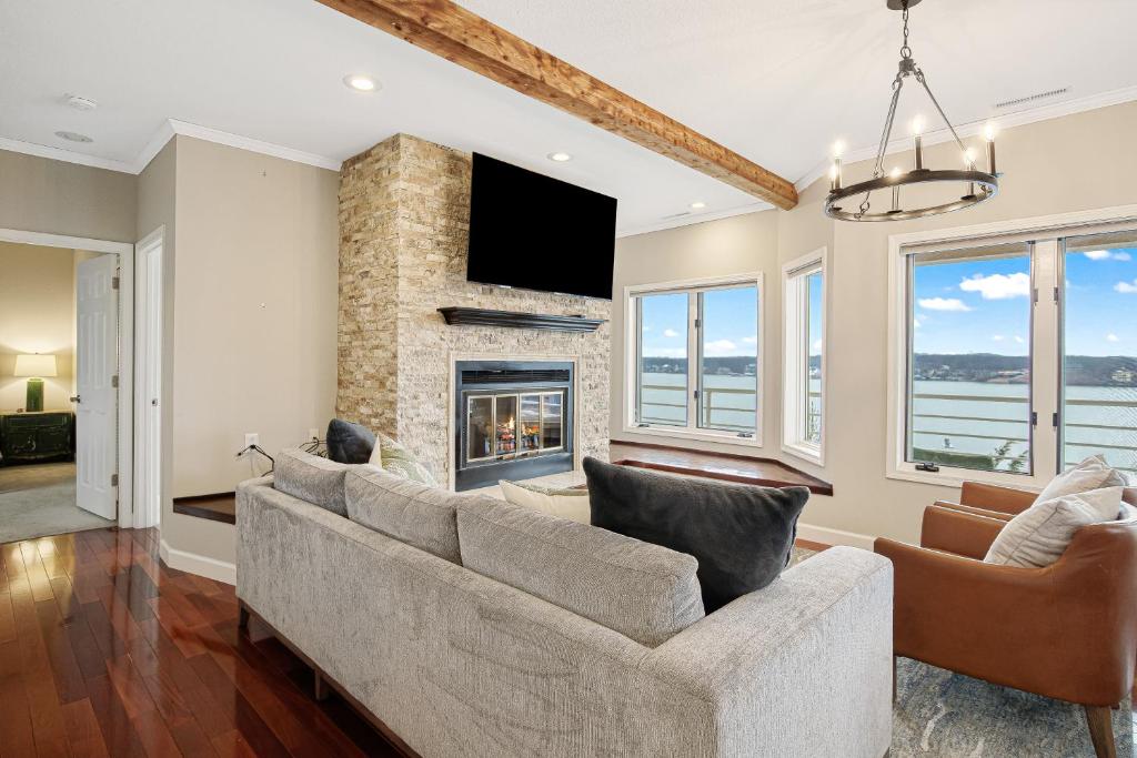 a living room with a couch and a fireplace at Emerald Bay Unit 1B in Lake Ozark