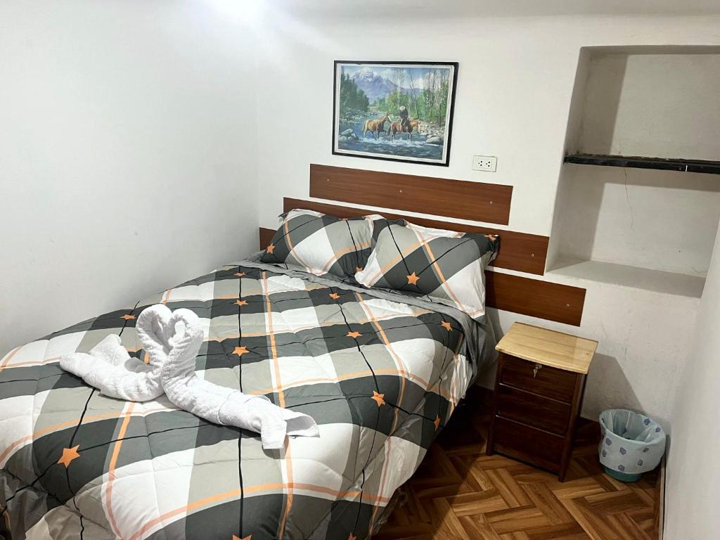 Postel nebo postele na pokoji v ubytování Hospedaje Rumiñahui