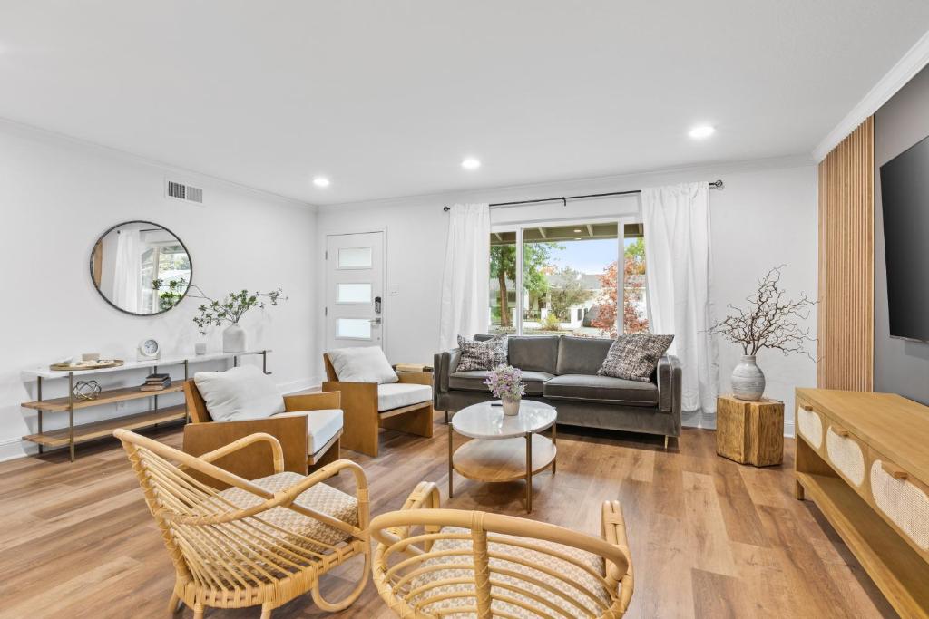 a living room with a couch and a table at @ Marbella Lane - Fresh and Vibrant 3BR Home in San Jose