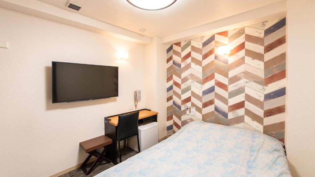 TV a/nebo společenská místnost v ubytování Yokohama Town Hotel