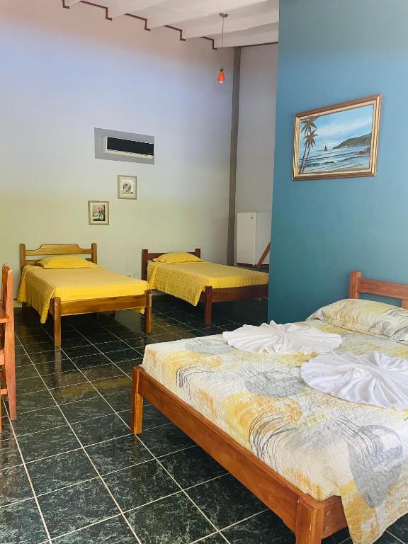 Postel nebo postele na pokoji v ubytování Hotel El Chaman