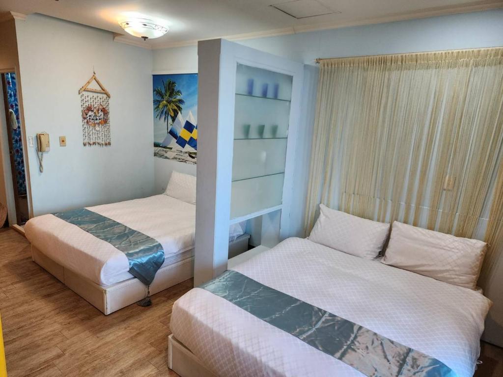 Postel nebo postele na pokoji v ubytování MB Hotel