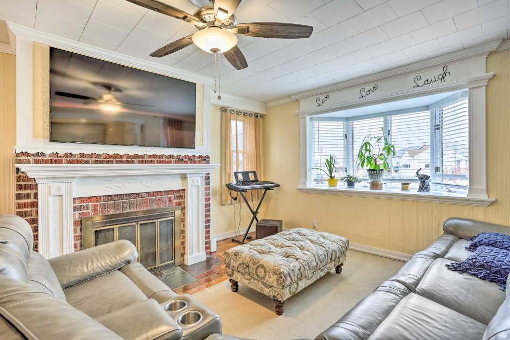 a living room with a couch and a fireplace at Family Vacation Rental 18 Mi to Philadelphia in Gibbstown