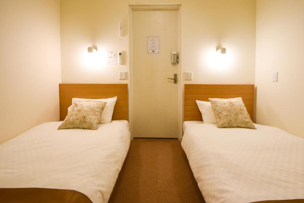Letto o letti in una camera di Comfy Stay Sarusawaike