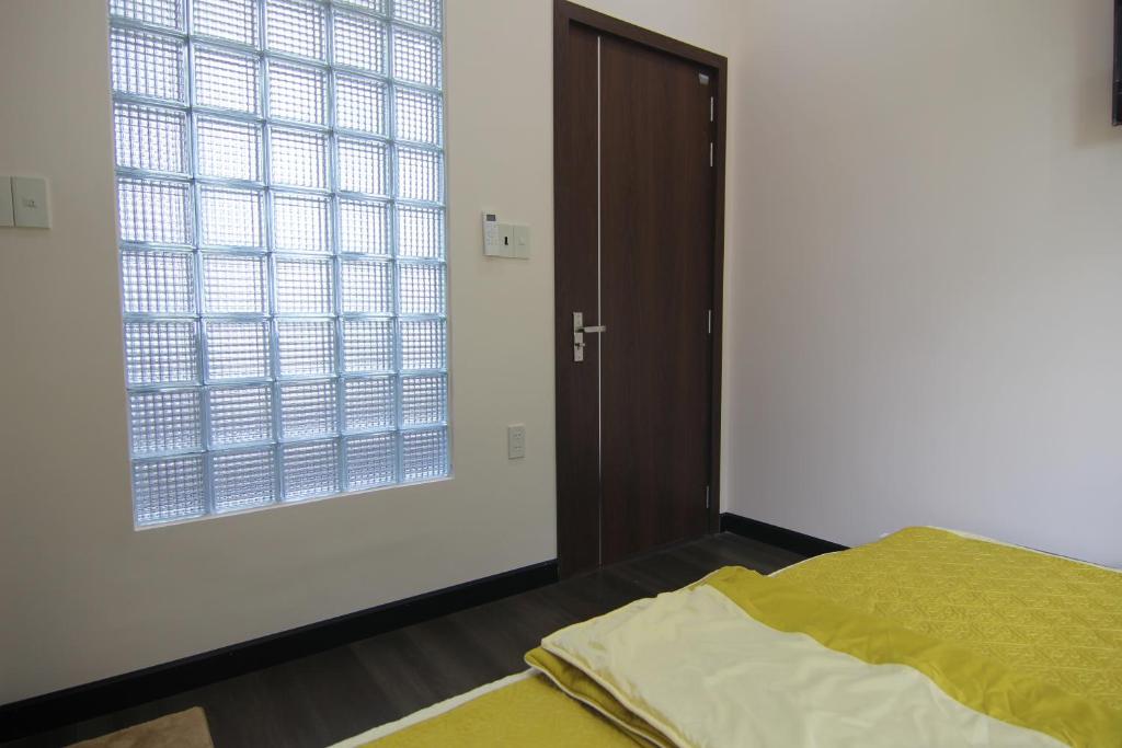 Giường trong phòng chung tại Dory Homestay