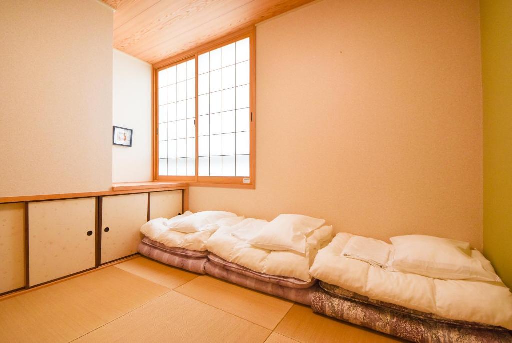 Letto o letti in una camera di Comfy Stay Sarusawaike