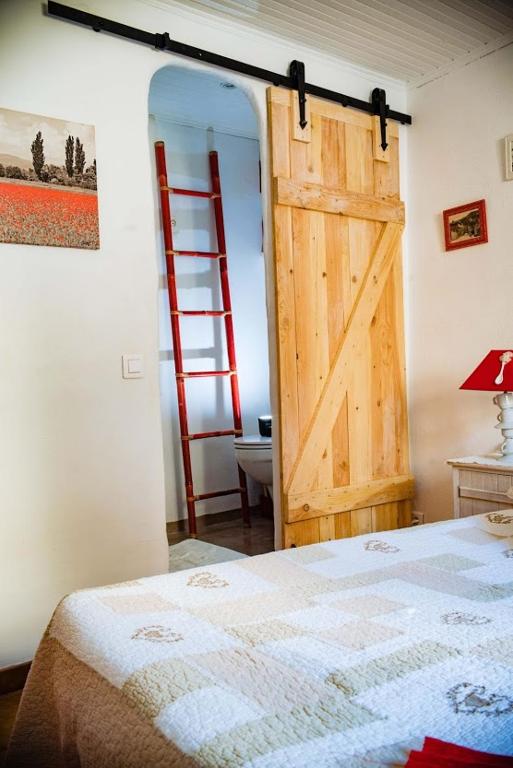 Postel nebo postele na pokoji v ubytování Gite Fa Mille maison bleu