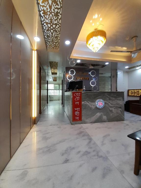 a lobby of a hotel with a reception desk at Hotel Shahin(residential) in Dhaka