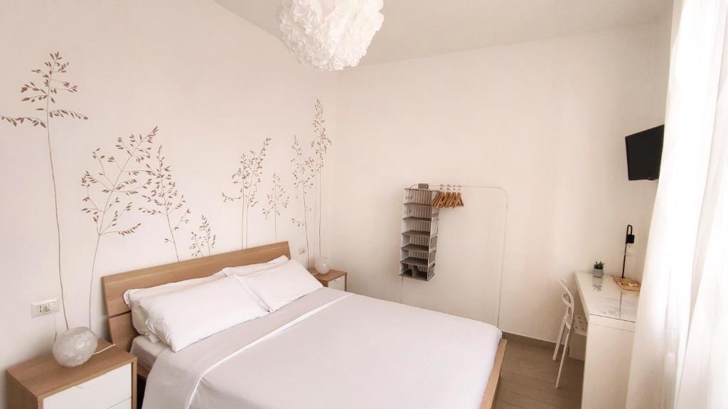 Postel nebo postele na pokoji v ubytování B&B Le Albarelle