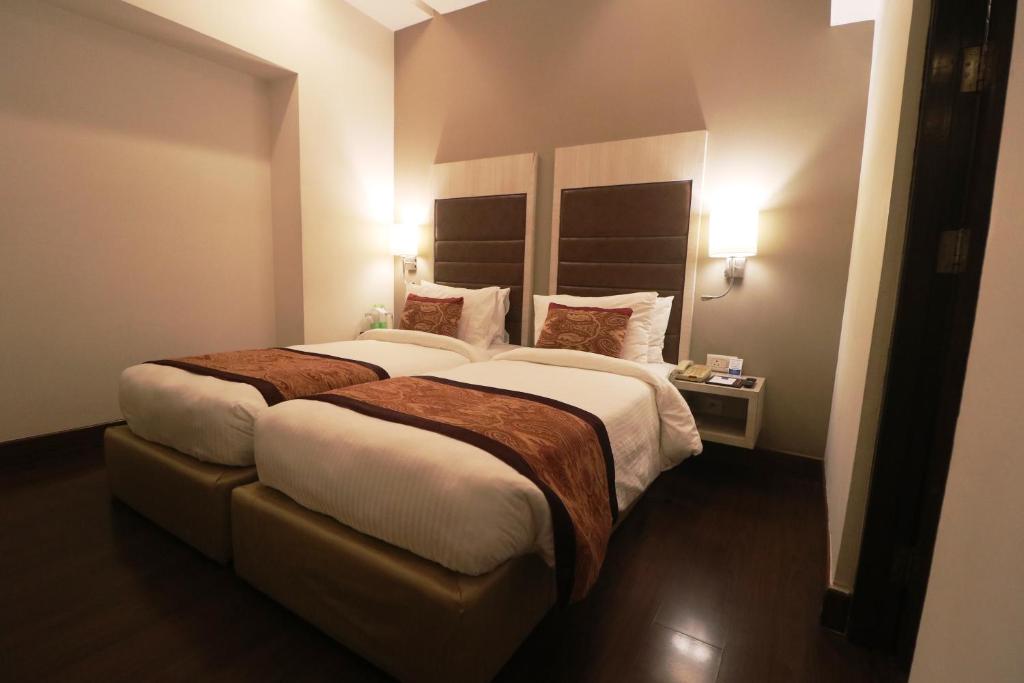 Mahagun Sarovar Portico Suites - 工作室-2张单人床
