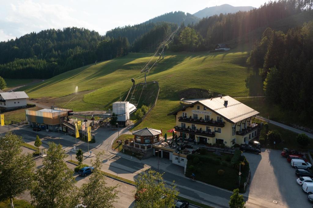 an aerial view of a resort with a ski lift at Gasthof zum Sessellift in Mitterbach