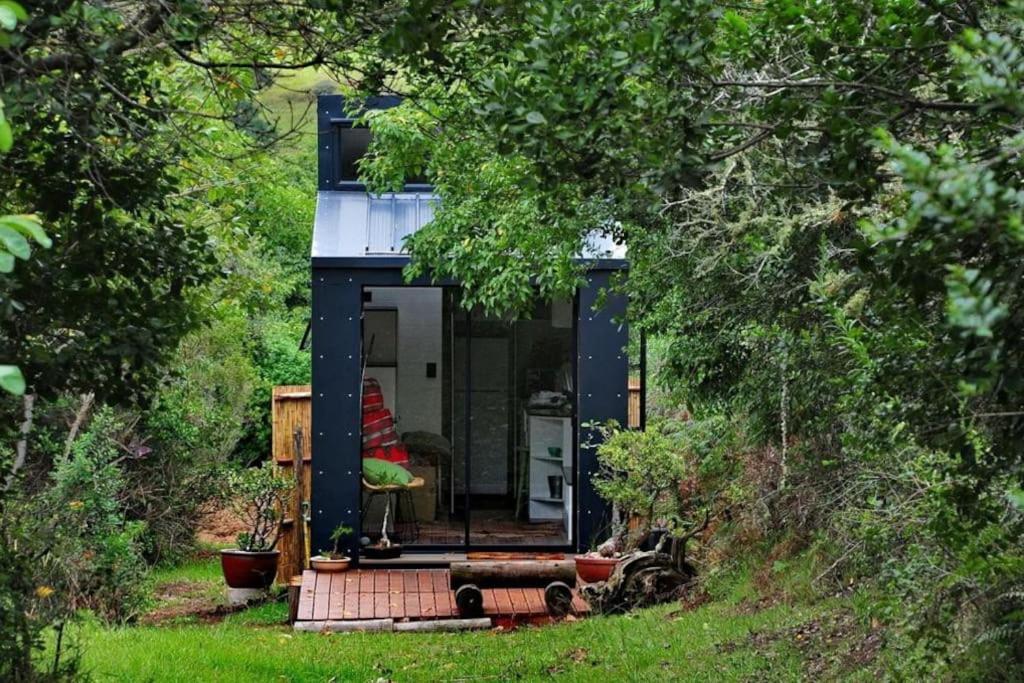 a tiny house in the middle of a forest at Tiny Home Trails End in Lovemore Park