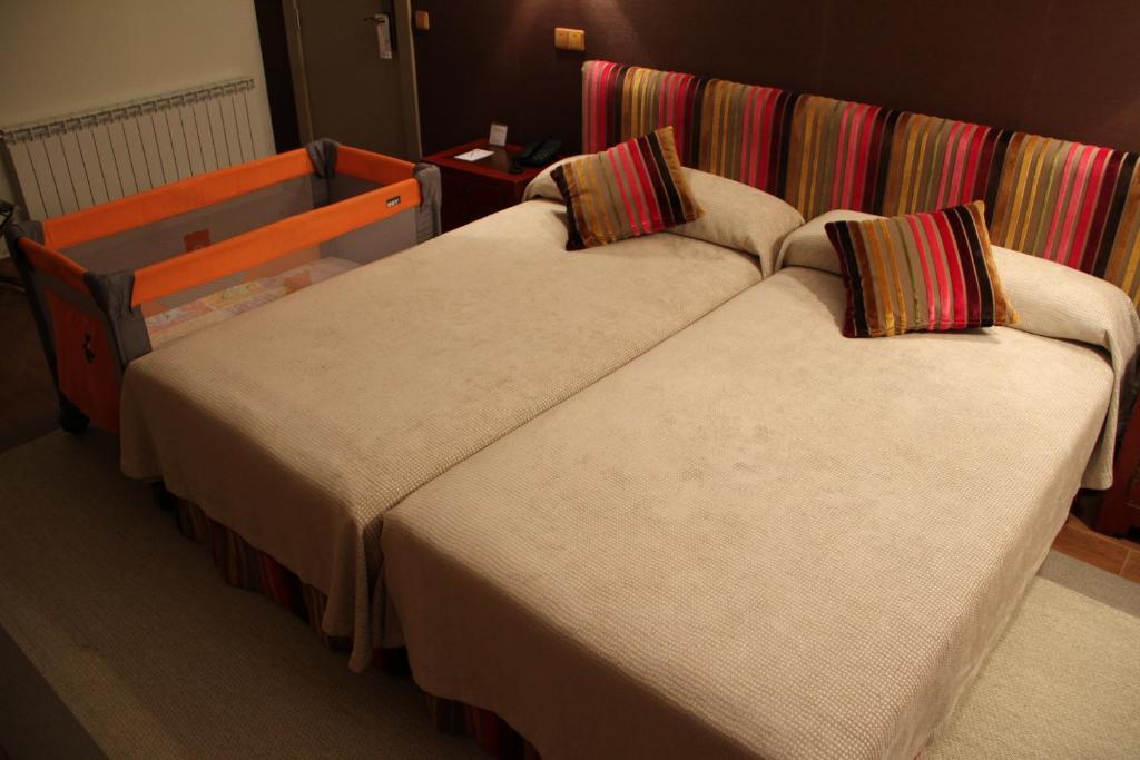 Cama o camas de una habitación en Hotel Palacio Dos Olivos