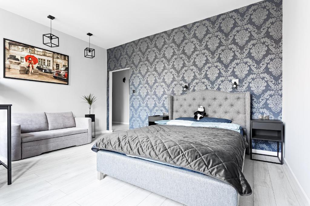 Posteľ alebo postele v izbe v ubytovaní Quiet Apartment Koscielna Old Town