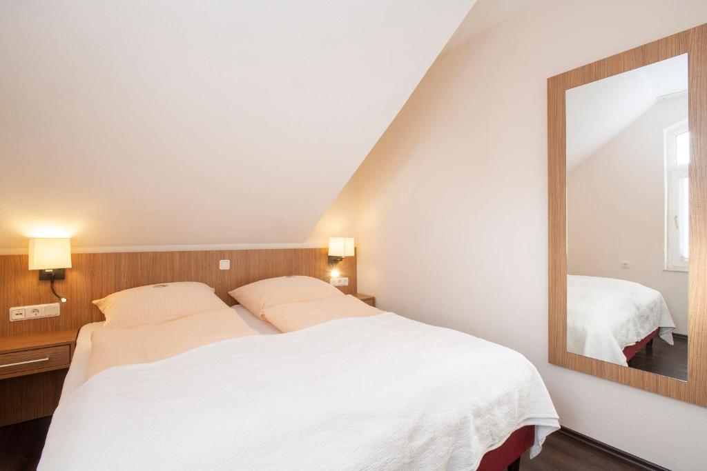 Postel nebo postele na pokoji v ubytování Appartementhaus Alte Post