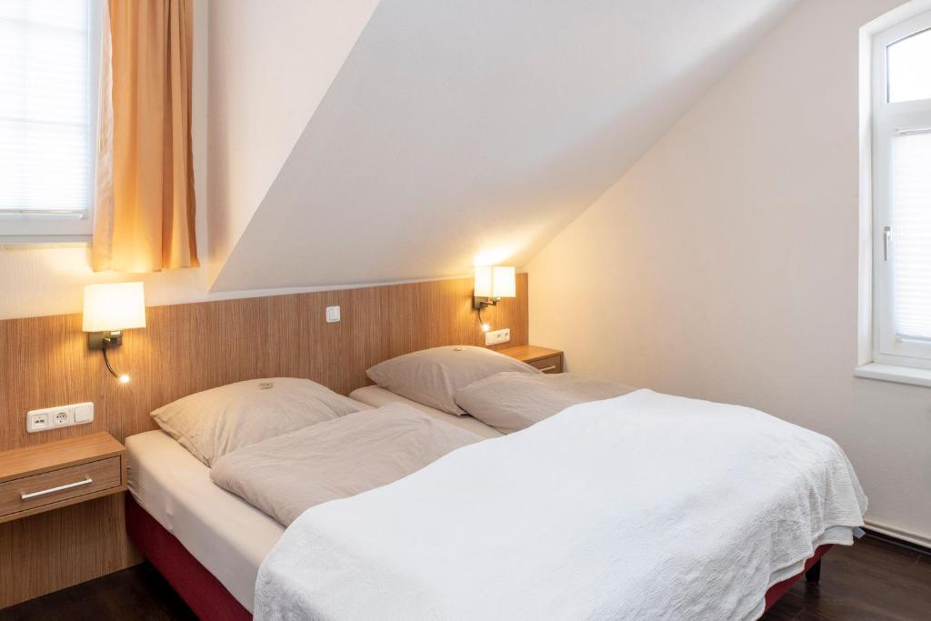 Postel nebo postele na pokoji v ubytování Appartementhaus Alte Post