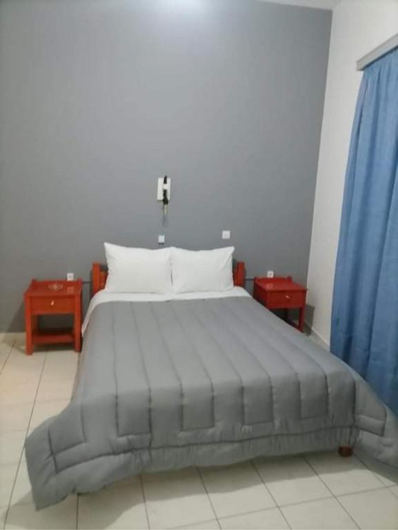 Postel nebo postele na pokoji v ubytování Hotel Theoxenia