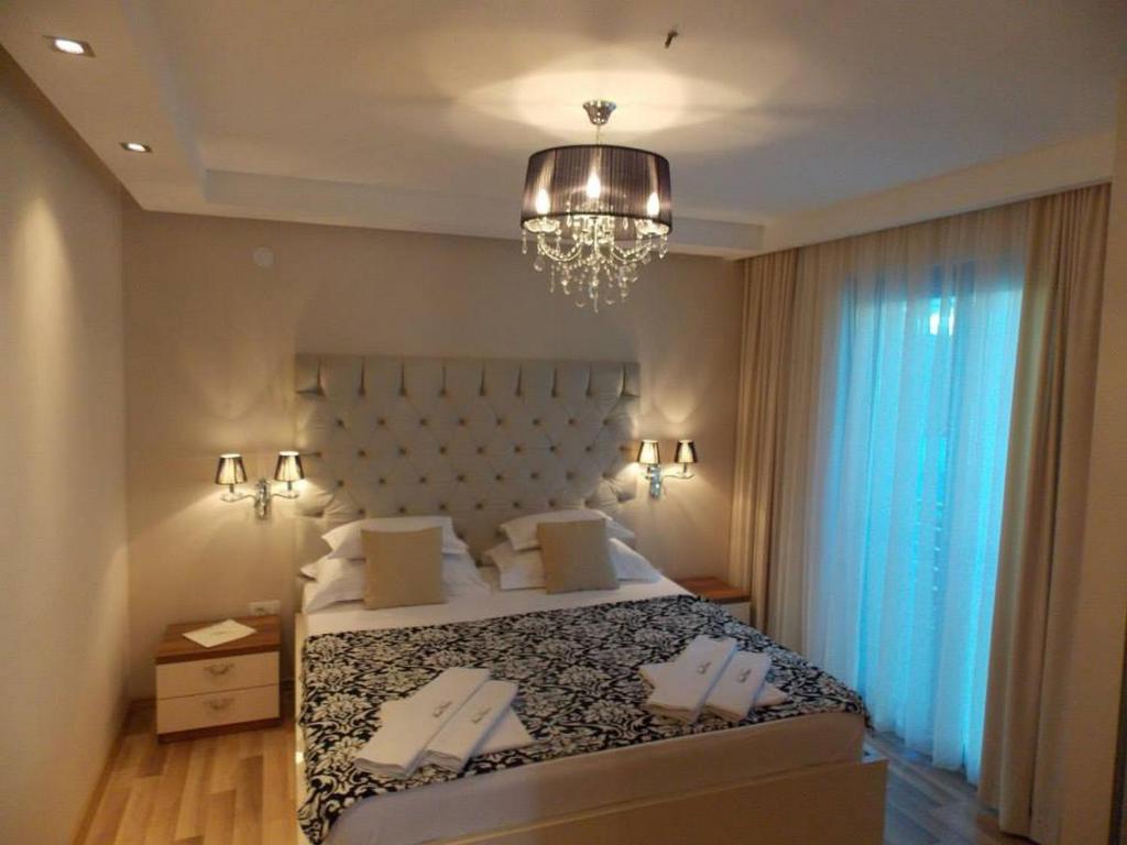 Ліжко або ліжка в номері Apartments and Rooms Grand Palazzo