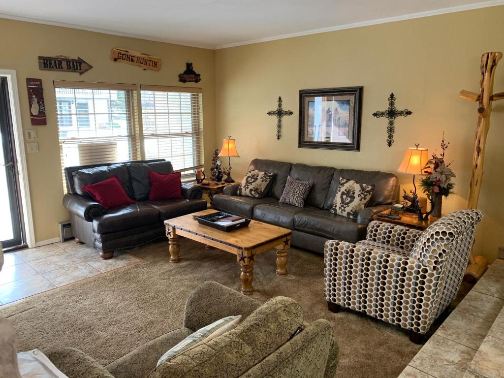 a living room with a couch and a table at Claim Jumper 9 Townhouse With High Speed Wifi in Red River