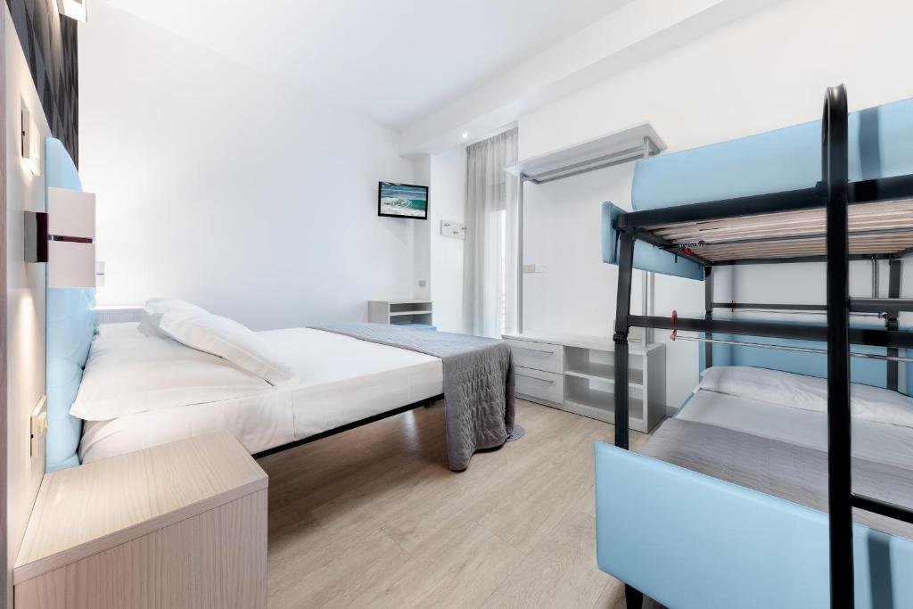 Letto o letti in una camera di Hotel Eiffel