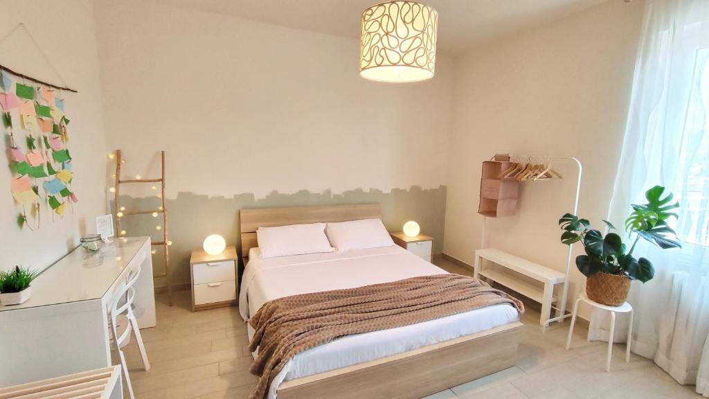 Postel nebo postele na pokoji v ubytování B&B Le Albarelle