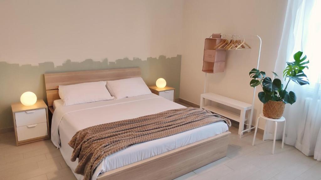 Postel nebo postele na pokoji v ubytování B&B Le Albarelle