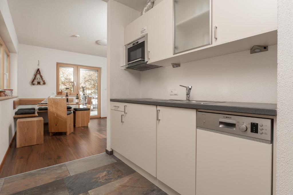 Kuchyň nebo kuchyňský kout v ubytování Aparthotel Ambiente