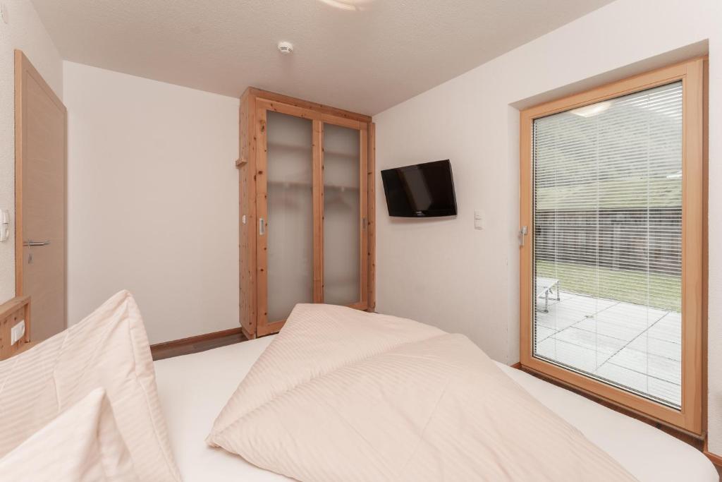 Postel nebo postele na pokoji v ubytování Aparthotel Ambiente