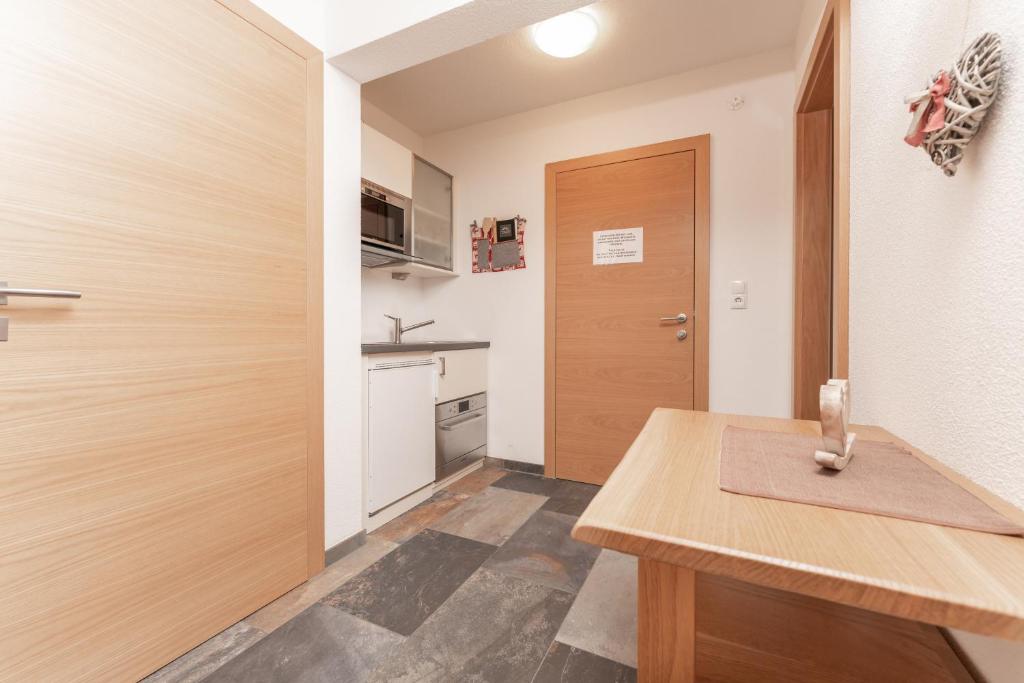 Kuchyň nebo kuchyňský kout v ubytování Aparthotel Ambiente