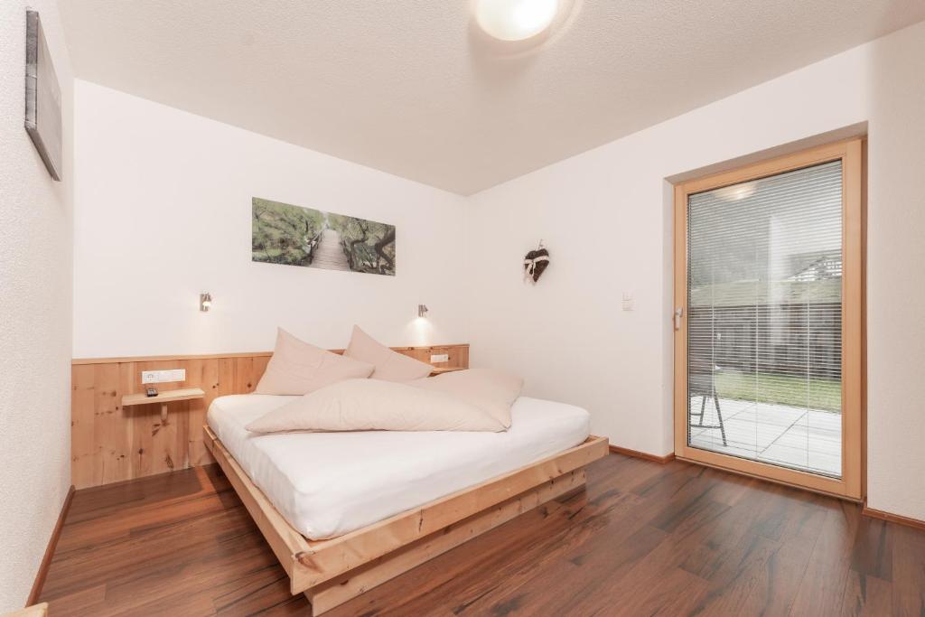 Postel nebo postele na pokoji v ubytování Aparthotel Ambiente