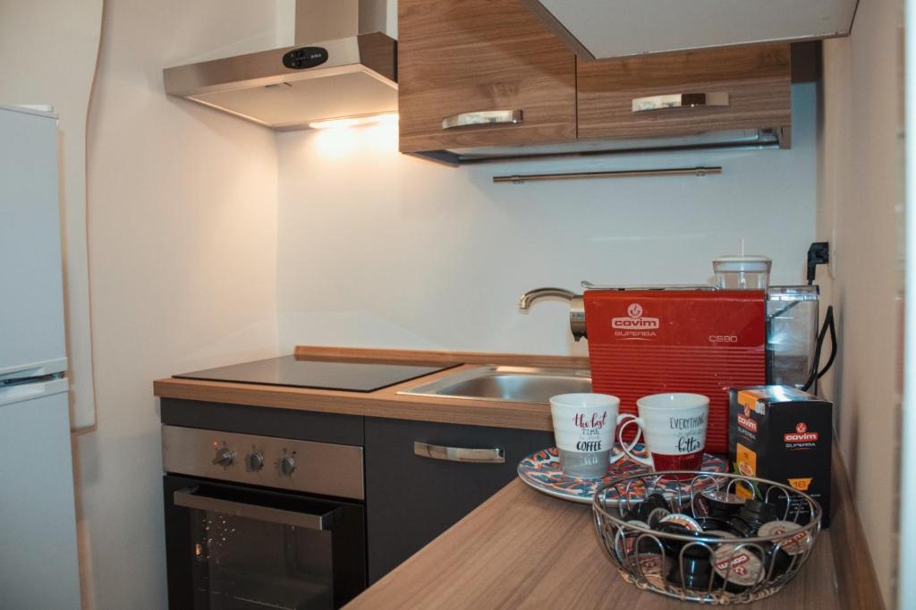 Kuchyň nebo kuchyňský kout v ubytování Casa Morrone Residence