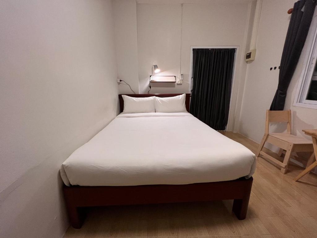 Postel nebo postele na pokoji v ubytování Naisang Hostel