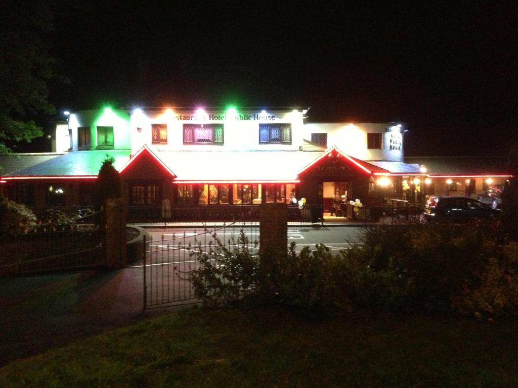 a building with christmas lights on it at night at The Plough Inn in Pocklington