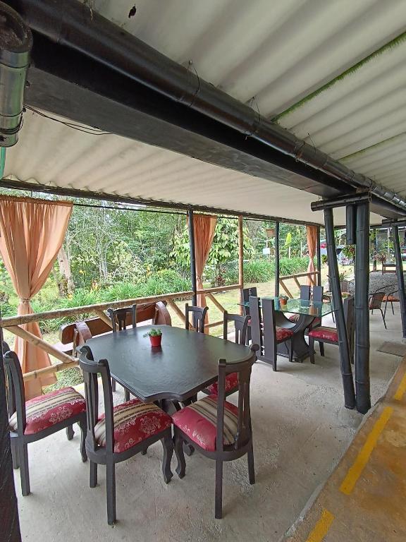 a group of tables and chairs in a tent at El ZORZAL in Salento
