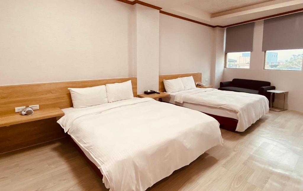 Postel nebo postele na pokoji v ubytování Beauty Garden Hotel - Jiaoxi