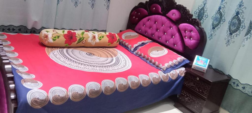 a bed in a room with a cake on it at Stunning 1-Bed Apartment in Dhaka close to airport in Dhaka