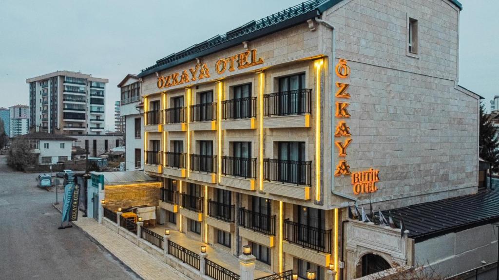 a building with a sign on the side of it at Özkaya Otel in Sivas