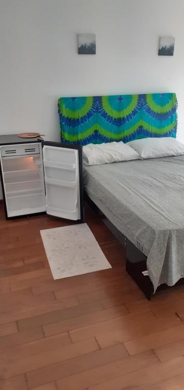a bedroom with a bed and a stove at El libertador in Miraflores
