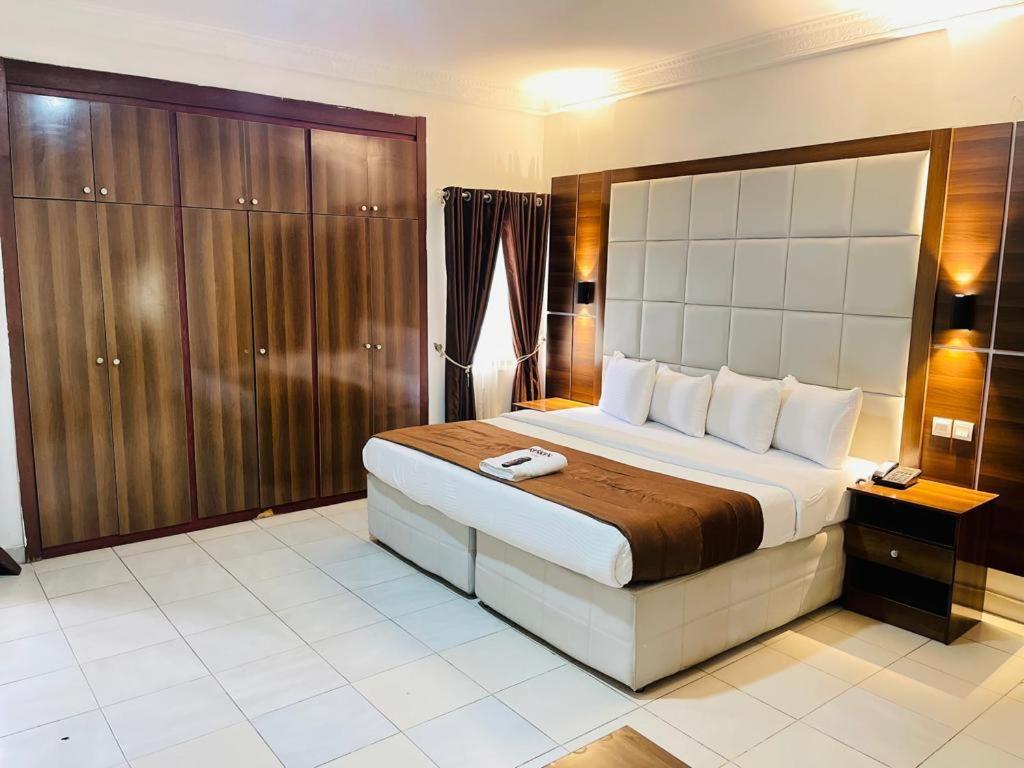 a bedroom with a large bed in a room at Presken Shonibare Estate in Lagos