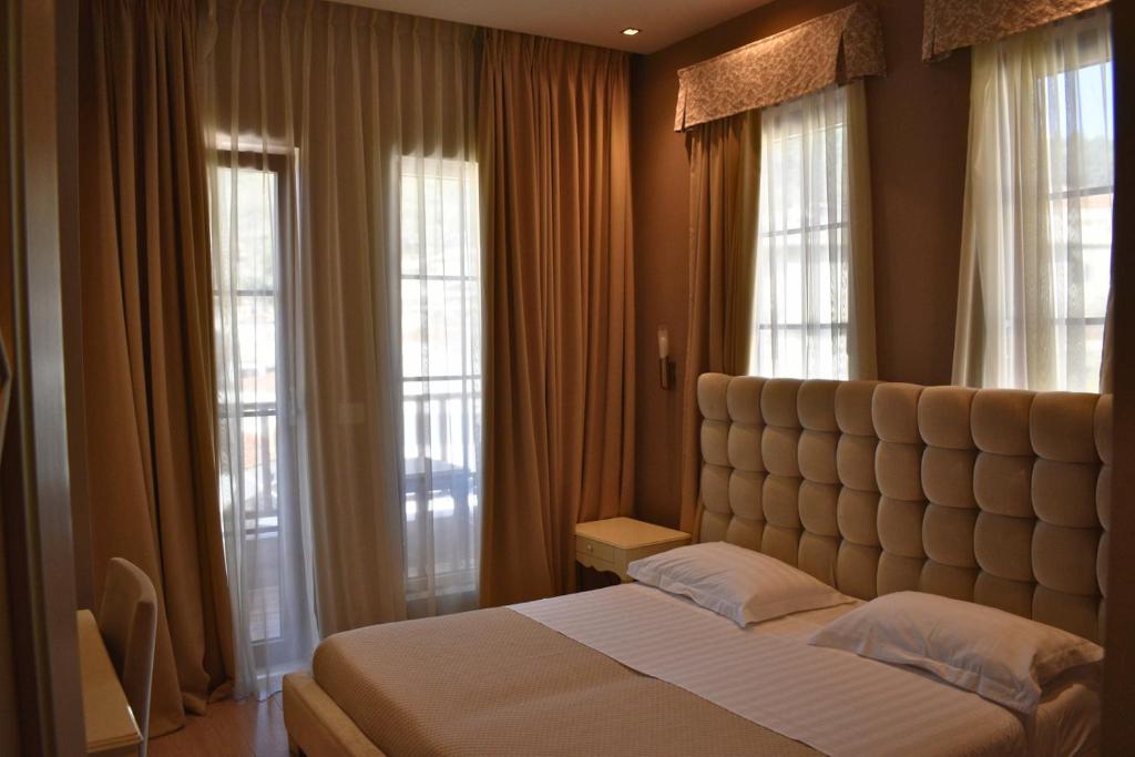 Letto o letti in una camera di Hotel Rezidenca Desaret