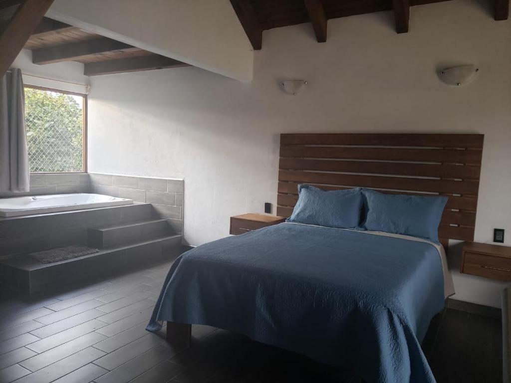 Postel nebo postele na pokoji v ubytování Cabaña Erendy2