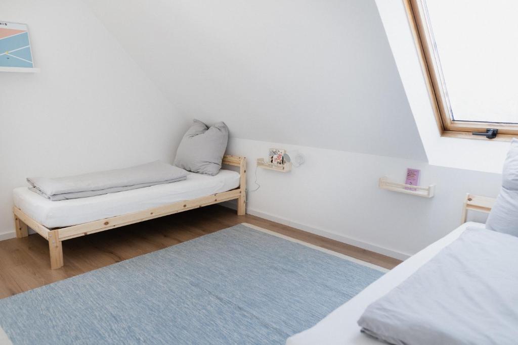 a small room with a bench and a window at our farm Ferienwohnung in Grasberg