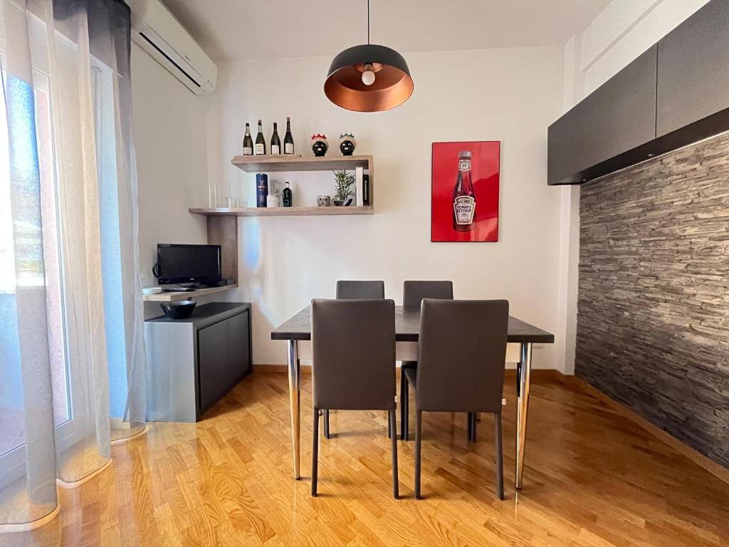 a dining room with a table and chairs at Davide Rome Apartment in Rome