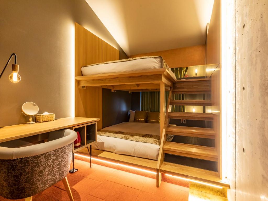 Postel nebo postele na pokoji v ubytování Hale Kyoto Tambaguchi