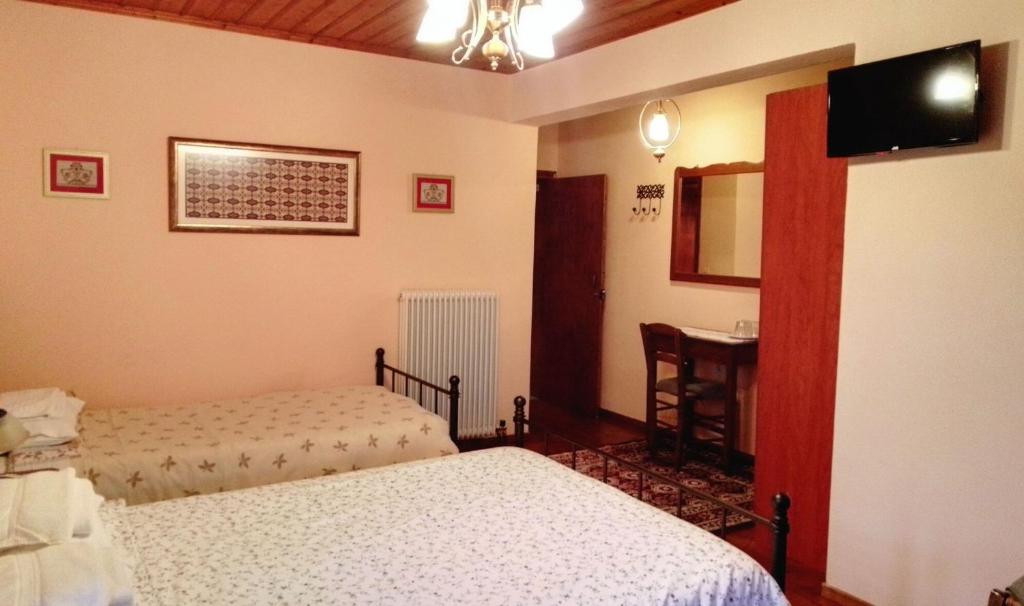 Postel nebo postele na pokoji v ubytování Xenonas Achnoulas